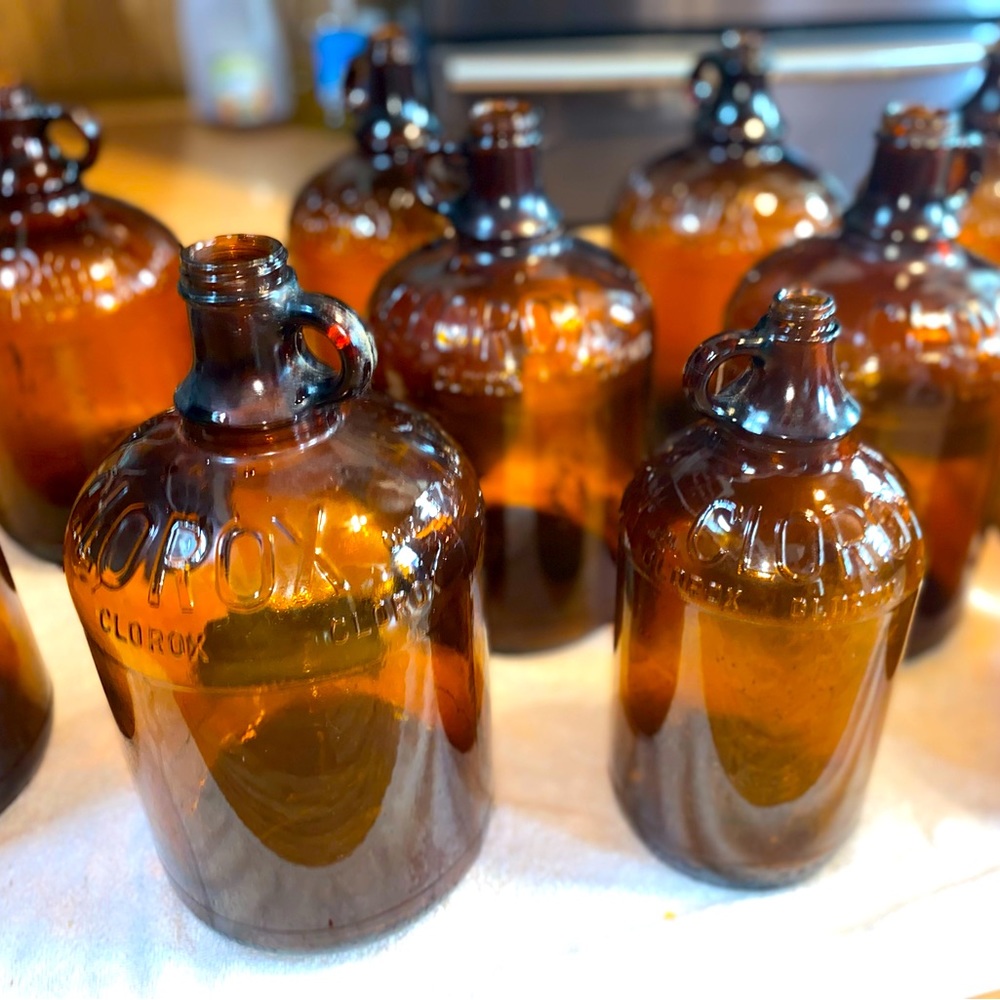 11 antique Clorox glass jugs